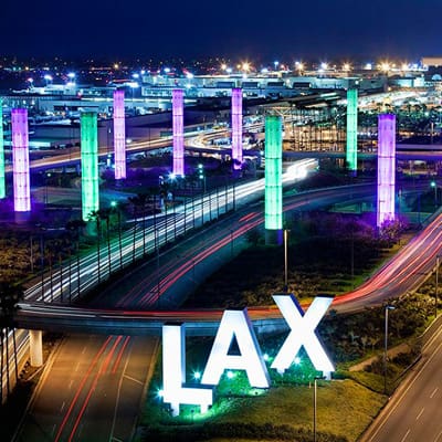 A view of the airport at night with lights on.