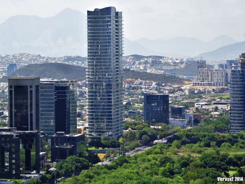 A view of some buildings and trees in the city.